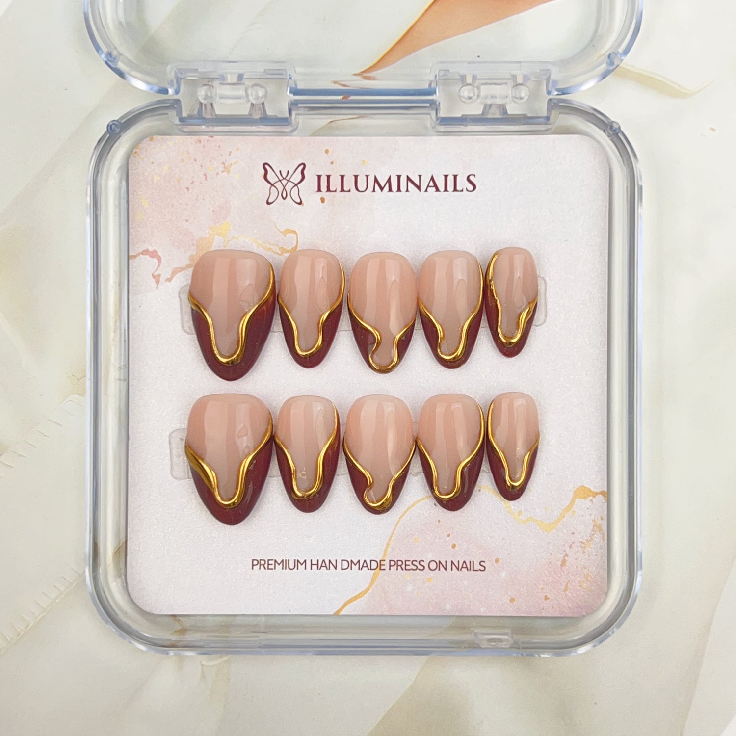 Golden Mocha press-on nails with nude, mocha and gold detailing