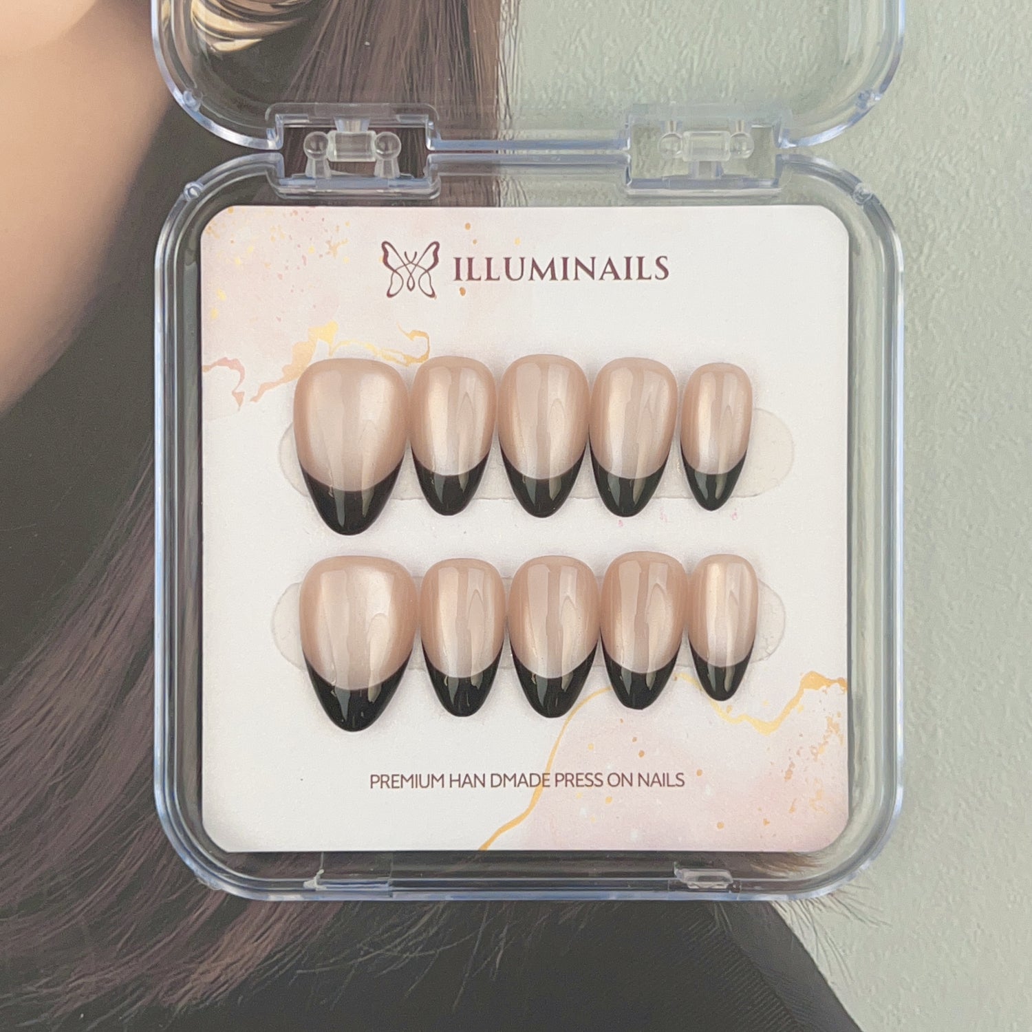 Black French Cat Eye press-on nails with nude bases and magnetic black tips