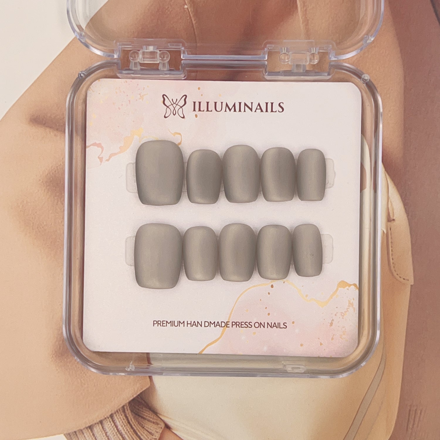 Brown matte cat-eye press-on nails in a short square shape