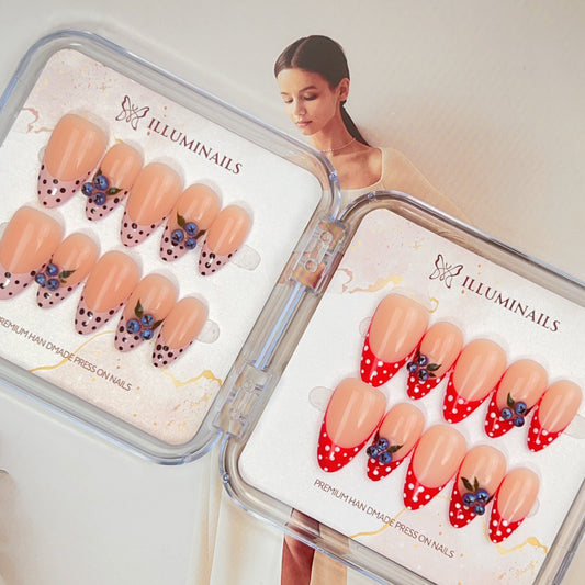 Blueberry Kiss French press-on nails with hand-painted blueberry details, polka dot French tips and soft nude base