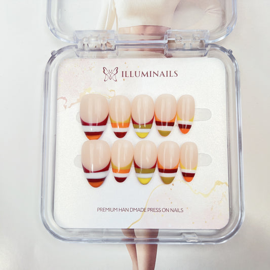 Sunset Stripe handmade French press-on nails with colorful striped tips in coral, orange, yellow and berry tones