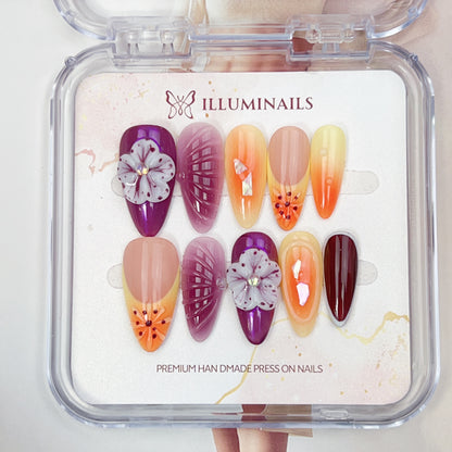 Mystic Bloom handmade floral press-on nails with orchid purple tones, sunset gradients and 3D flower details