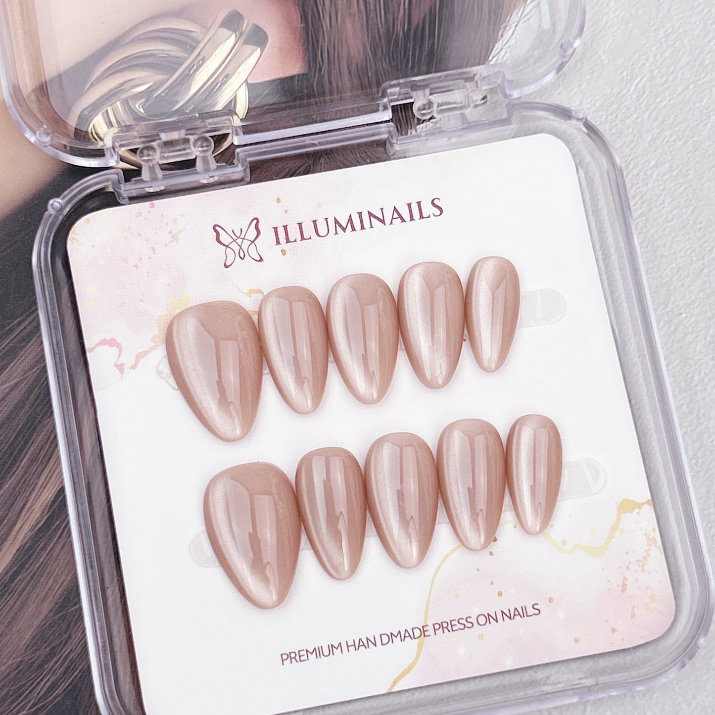 Cashmere Taupe cat eye press-on nails in a short almond shape