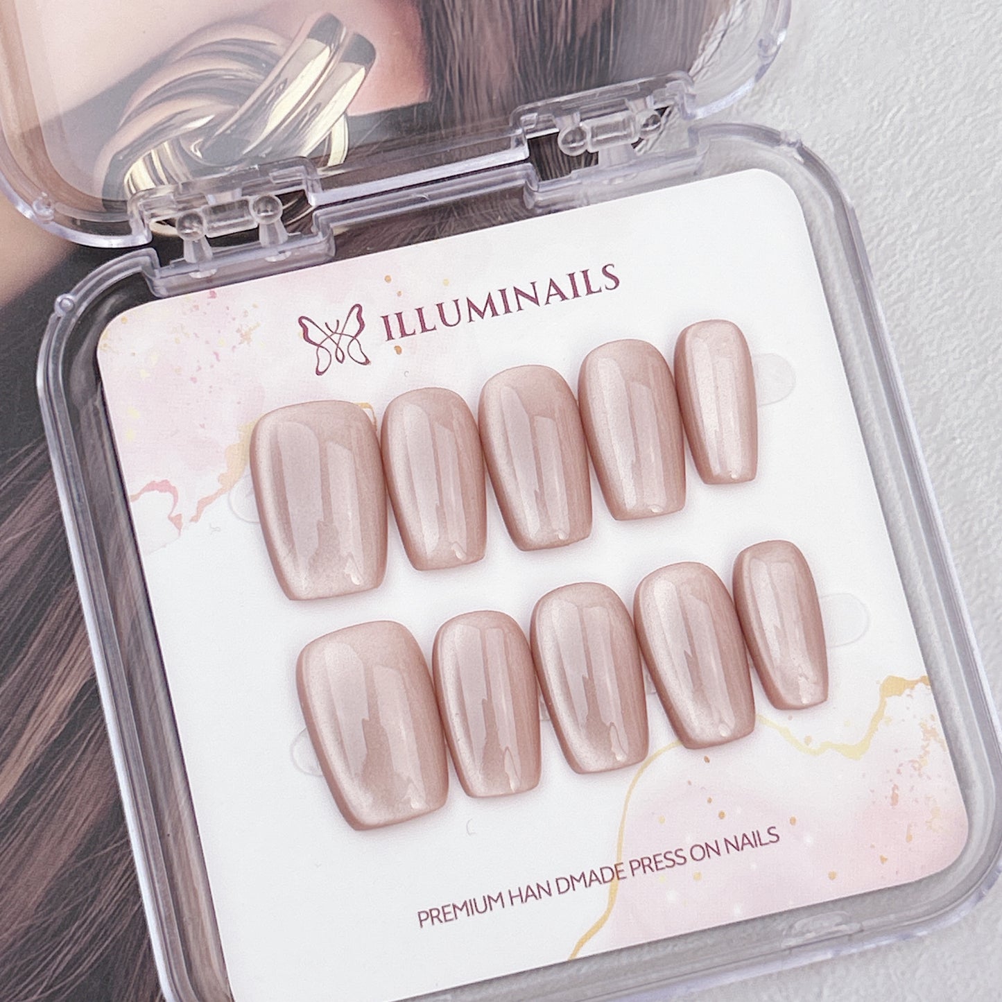 Cashmere Taupe cat eye press-on nails in a medium square shape