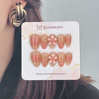Apricot Grace glossy apricot nails with raised swirl details