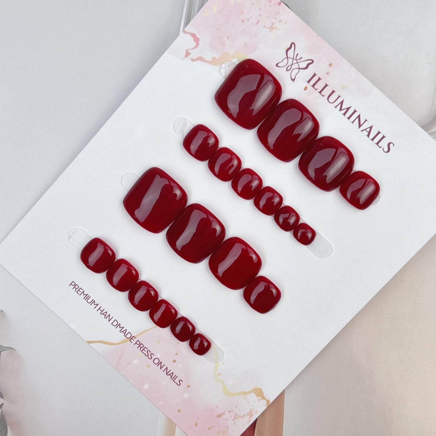 Burgundy solid press-on toenails from the Essential Pedi Collection