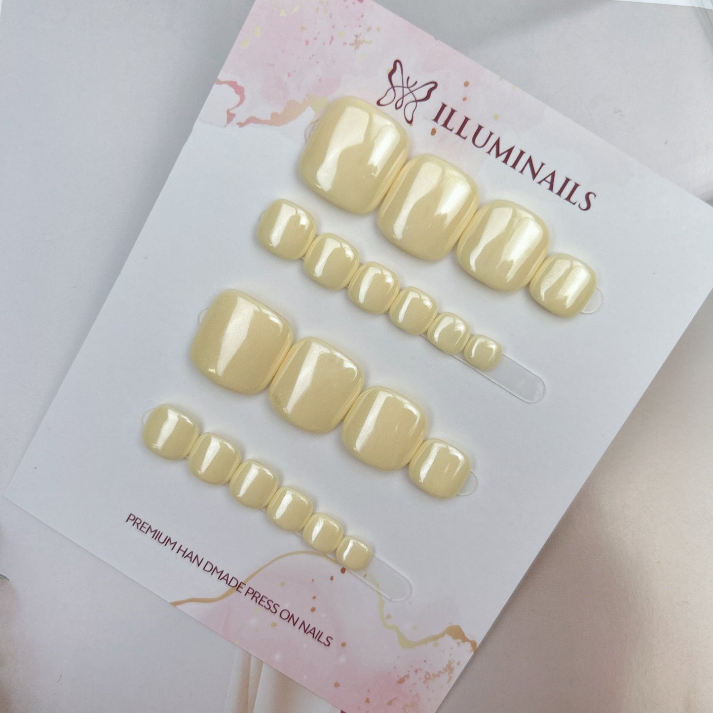 Butter Yellow glazed press-on toenails from the Essential Pedi Collection