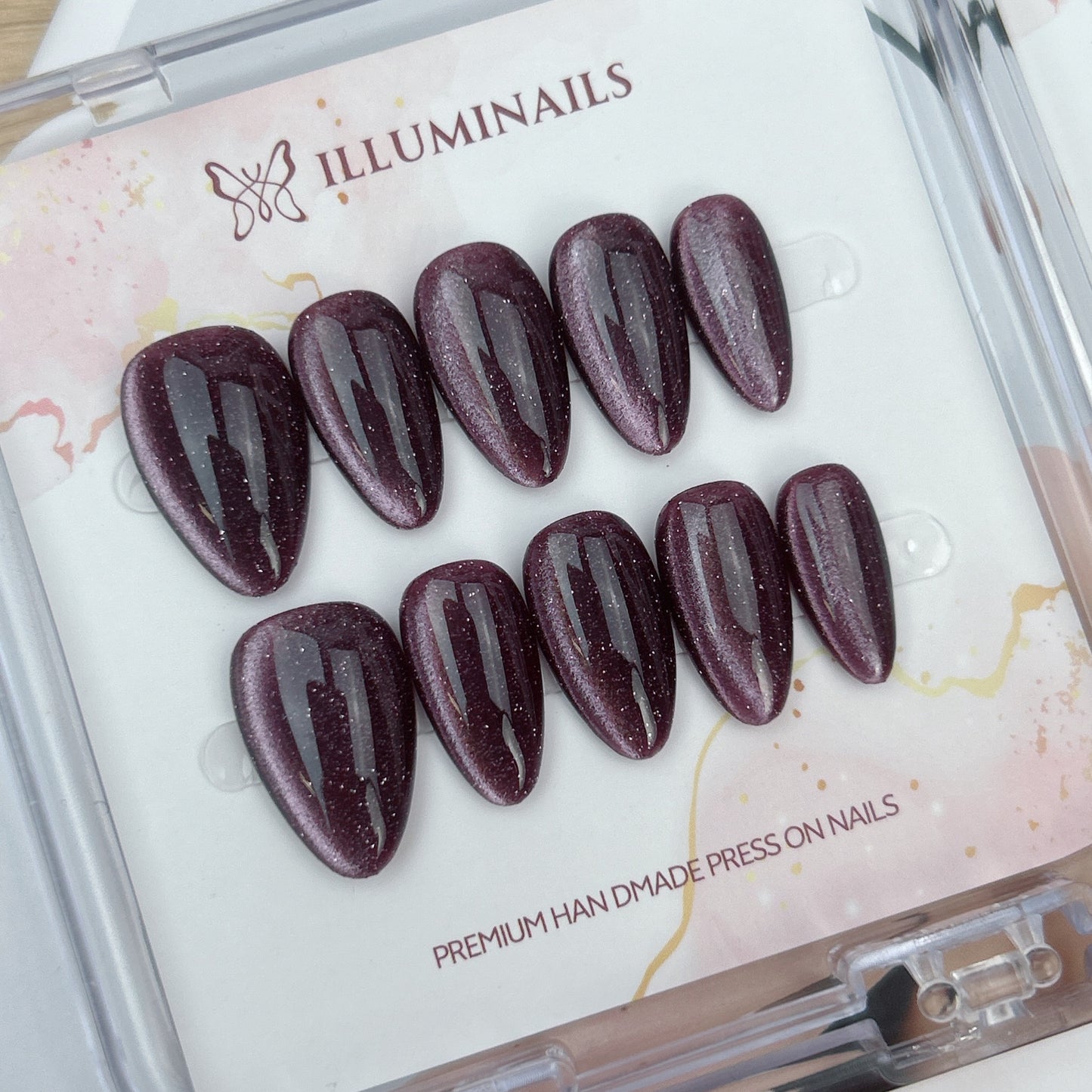 Mulberry Plum glitter cat eye press-on nails in short almond shape