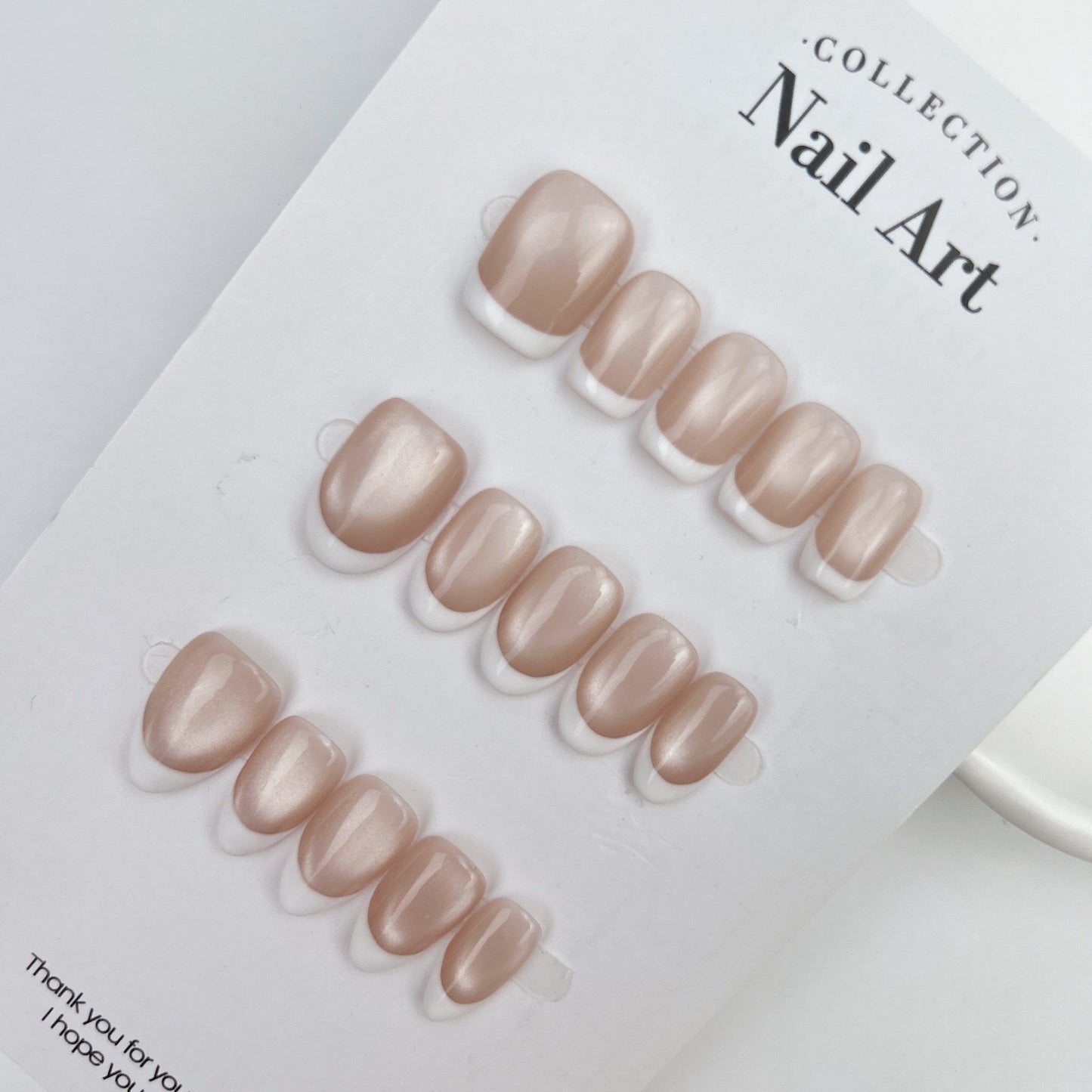 Champagne nude magnetic cat eye nails with white French tips