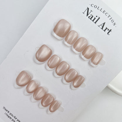 Champagne nude magnetic cat eye nails with white French tips