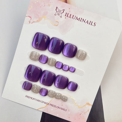Star Sand press-on toenails in Amethyst Purple cat eye with silver glitter accent toes