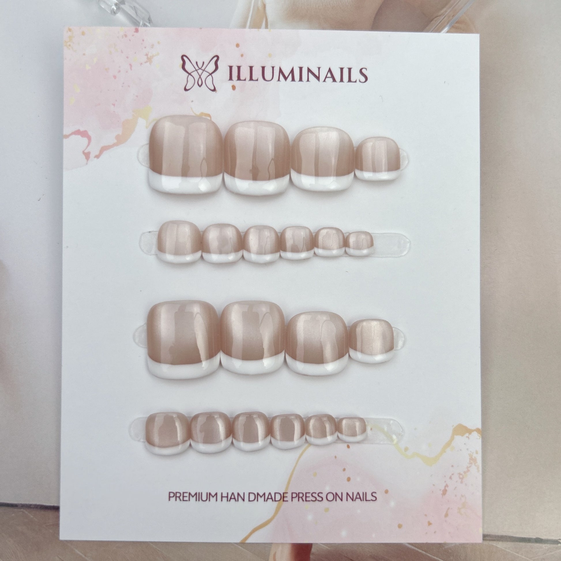 Front view of white French cat eye press-on toenail set
