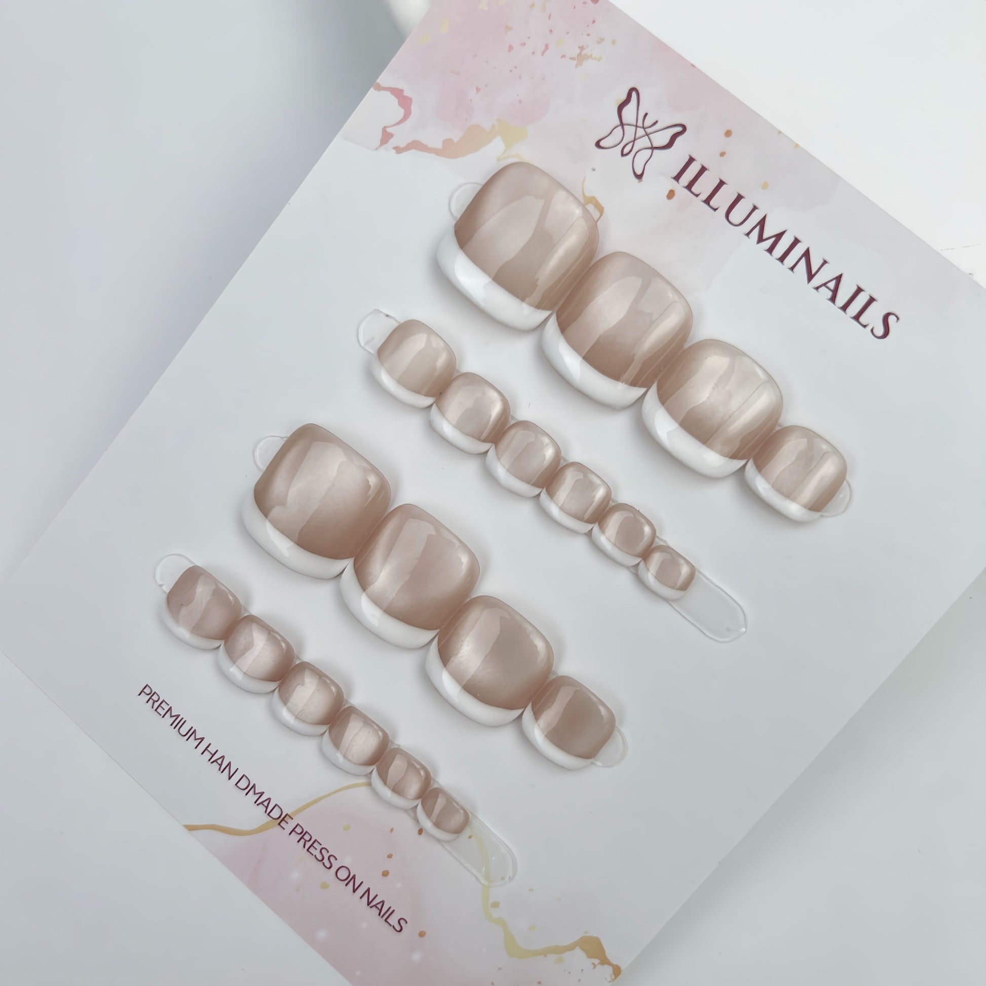 White French cat eye press-on toenails displayed on Illuminails card
